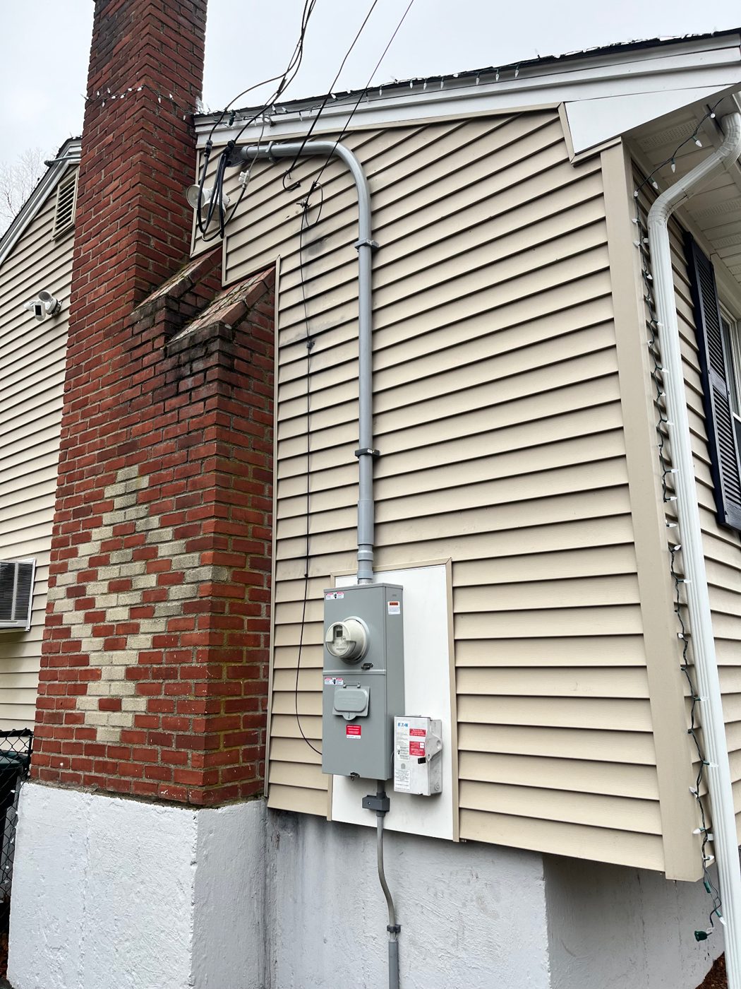New exterior meter and service disconnect installed by Medwid Electric on a South Shore home